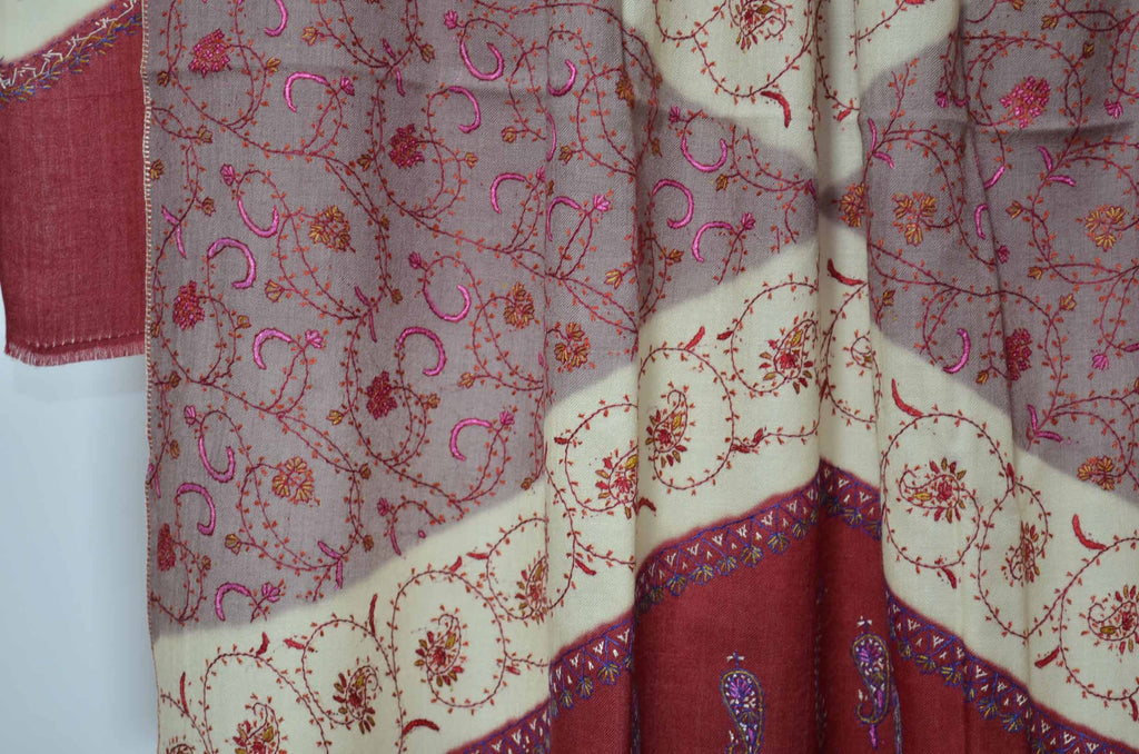 The best wool shawls to keep you warm. This triple dye shawl gives a royal look on you and has an amazing hand embroidery