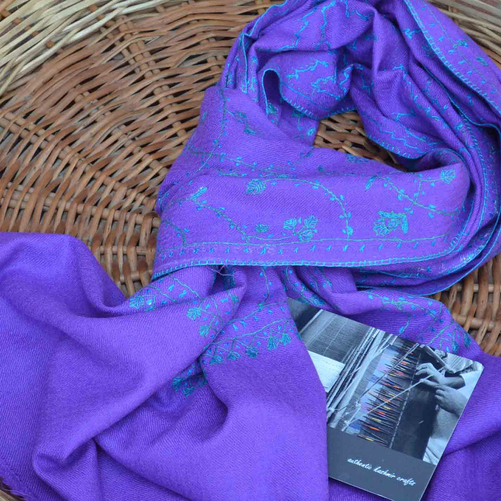 Pure merino woolen purple stole made with beautiful embroidery all over the scarf to make it look luxurious
