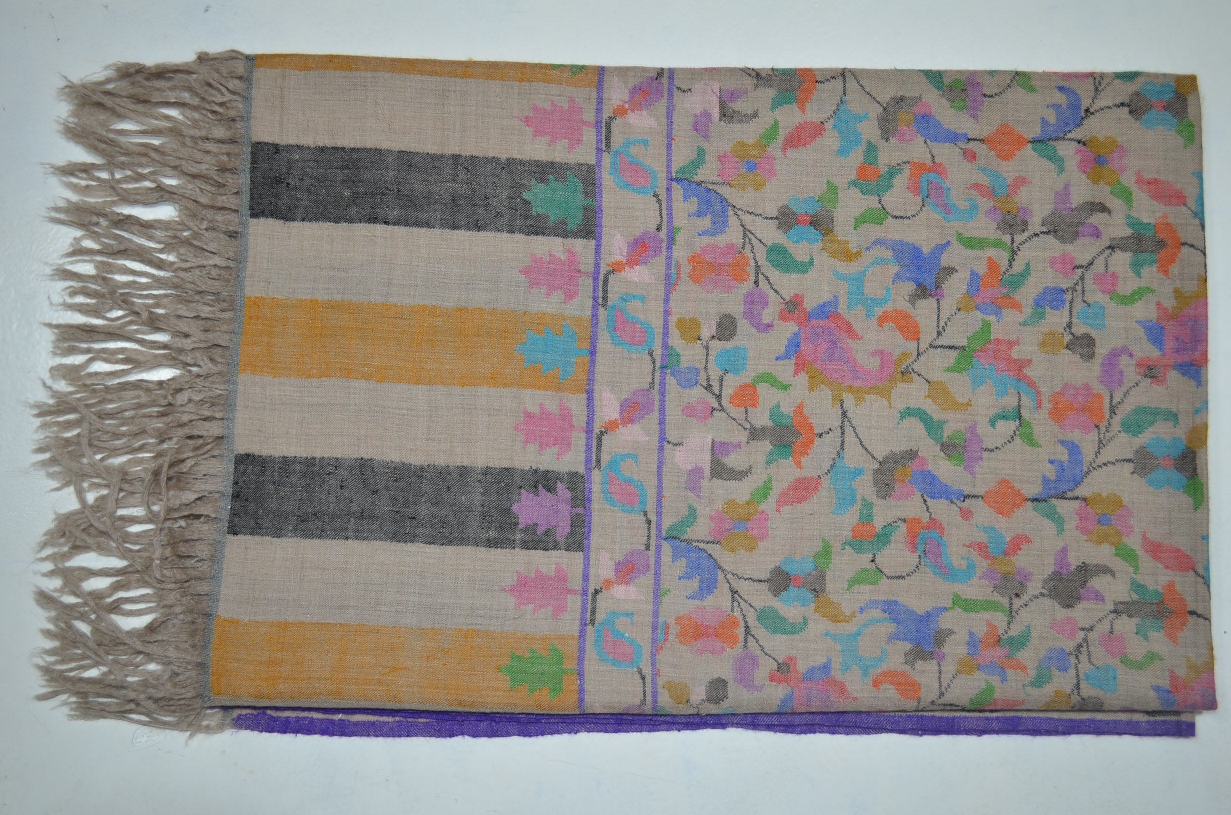 A luxurious Cashmere Pashmina jamawar kani shawl made from highest quality fibers. This kani shawl is a signature of royality. Buy and feel the softness and warmth of this pashmina kani shawl. Hand embroidered in Kashmir | purekashmir.com