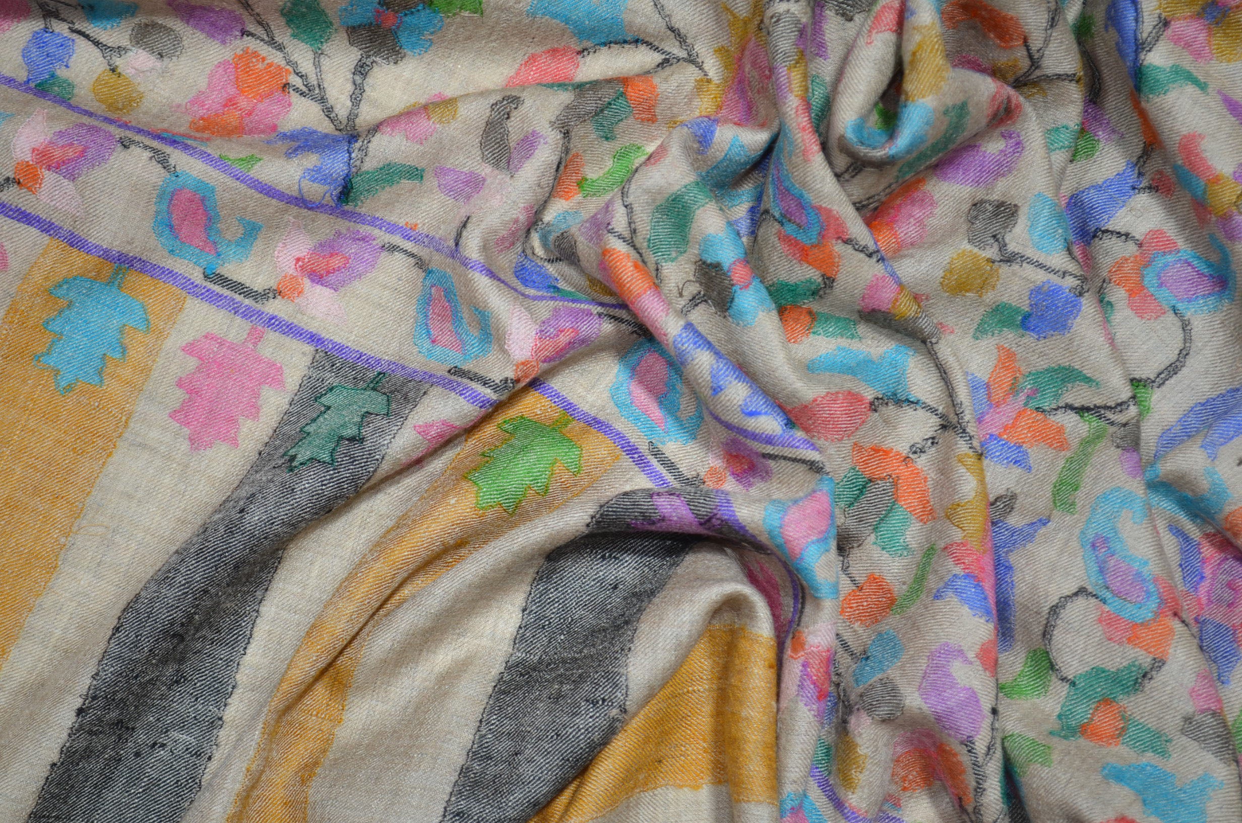 A luxurious Cashmere Pashmina jamawar kani shawl made from highest quality fibers. This kani shawl is a signature of royality. Buy and feel the softness and warmth of this pashmina kani shawl. Hand embroidered in Kashmir | purekashmir.com