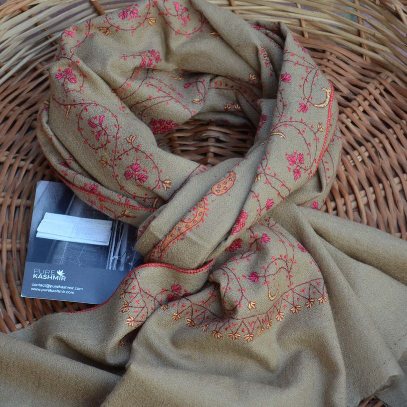 100% woolen cashmere embroidered scarf on a kashmiri basket