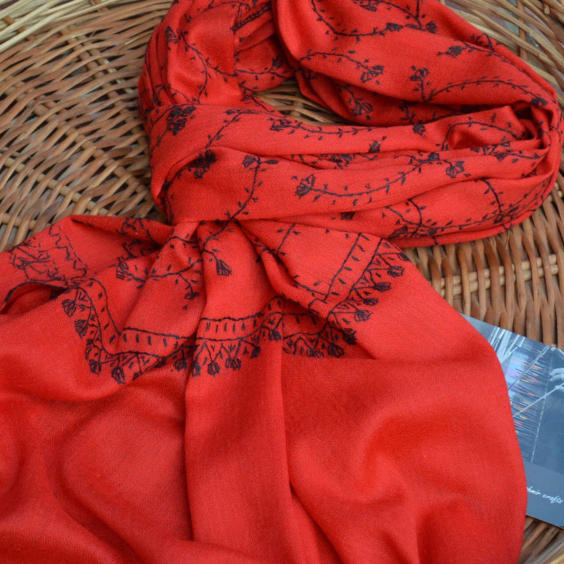 Beautiful red scarf with black embroidery all over the scarf. This cashmere woolen scarf is made from 100% natural fibers